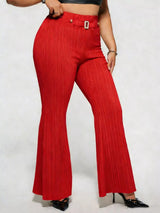 Model wearing red plus-size high-waisted flare pants styled with pointed-toe heels for an elegant and sophisticated look.