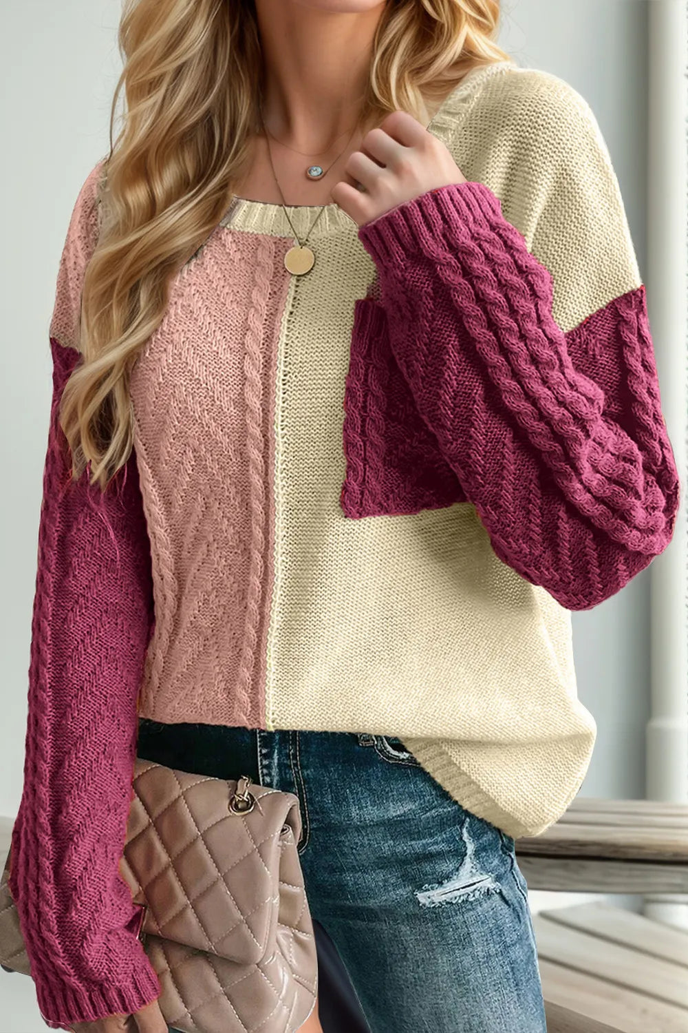 Double Take women’s red and violet color block cable-knit drop shoulder sweater with front pocket and long sleeves.