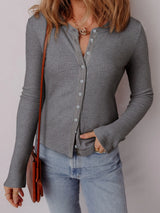 Women's ribbed button-up cardigan with subtle shimmer, long sleeves, and fitted silhouette, perfect for layering with jeans and fall outfits, available in sizes Small–XL.