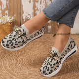 Leopard print shoes worn with jeans on a woven surface