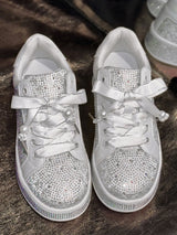 White round toe women’s sneakers with rhinestone embellishments, satin-style ribbon laces and pearl-inspired accents.