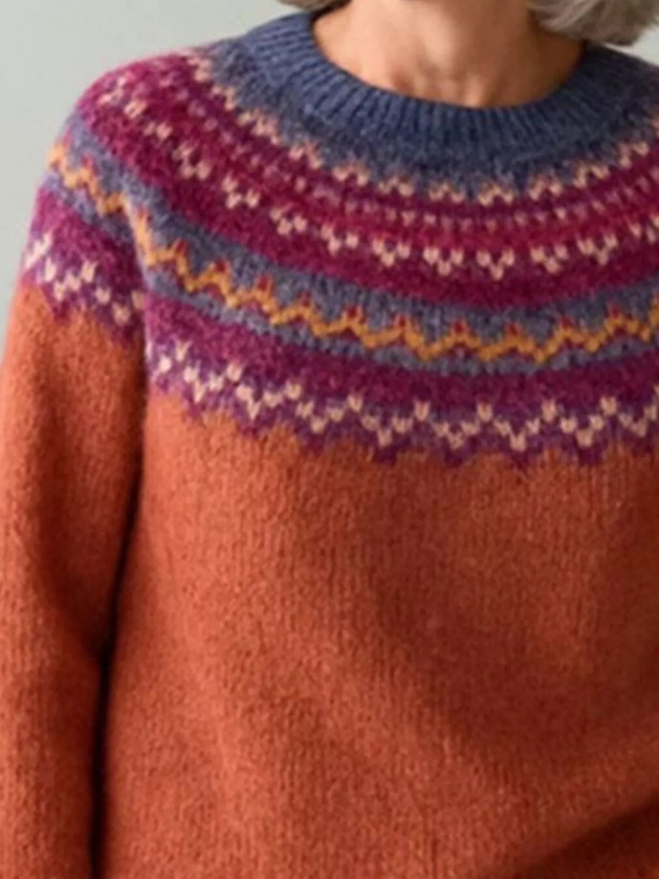 Women’s vintage patterned round neck sweater in rust with multicolor yoke design, available in sizes Small through 5XL.