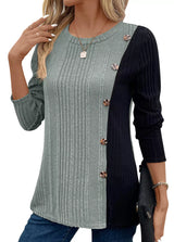 Women’s sage and black color block ribbed knit long sleeve top with decorative side buttons and slit detail, available in sizes Small–2XL.