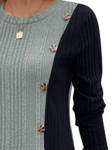 Women’s sage and black color block ribbed knit long sleeve top with decorative side buttons and slit detail, available in sizes Small–2XL.