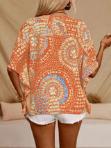 Sherbet printed V-neck top with half sleeves and a relaxed boho-inspired fit paired with white shorts.