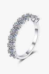 1 Carat Moissanite Half-Eternity Ring in rhodium-plated 925 sterling silver featuring sparkling round-cut moissanite stones along a polished silver band.