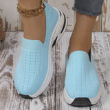 Sky blue women’s round toe mesh slip-on sneakers with a lightweight knit upper and sporty white and black rubber sole.