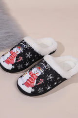 Black snowman round toe slippers with white faux fur trim, festive snowflake print, red scarf design, and black flat soles.