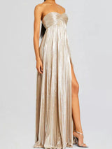Beige strapless gown with a high slit on a white background