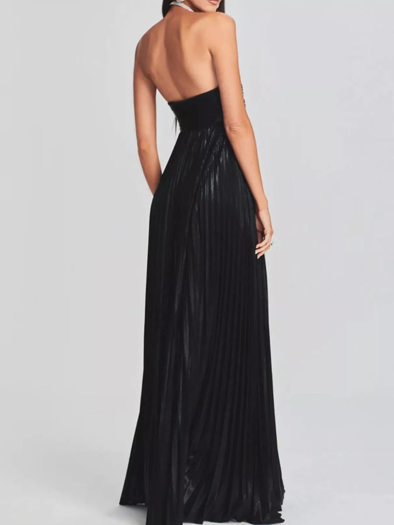 Black halter neck gown on a gray background