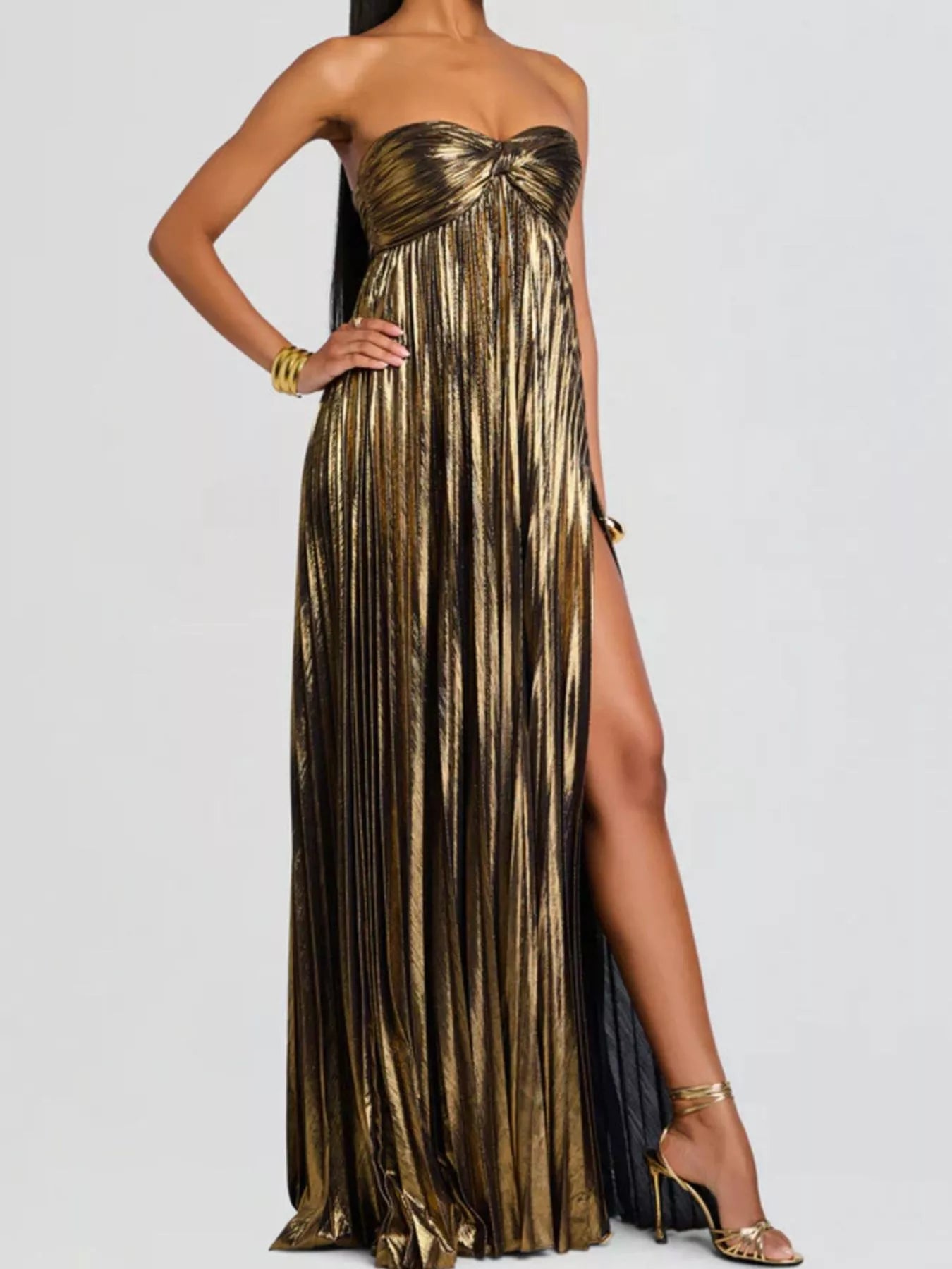 Khaki strapless pleated gown with a high slit on a white background