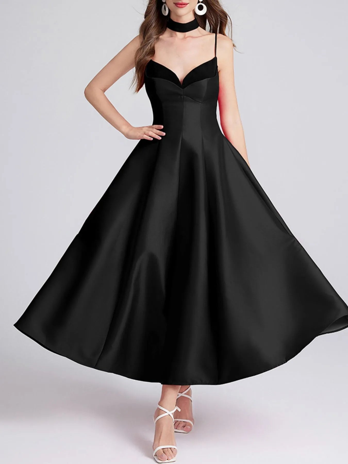 Black dress with a plain background