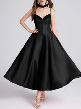 Black dress with a plain background