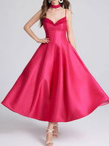 Rose Red satin dress on a plain background