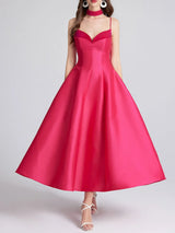 Rose red dress on a plain background