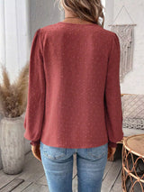 Women’s Swiss Dot Lace Detail Long Sleeve Blouse in rust with V-neck lace detailing and long sleeves, available in sizes S–2XL.