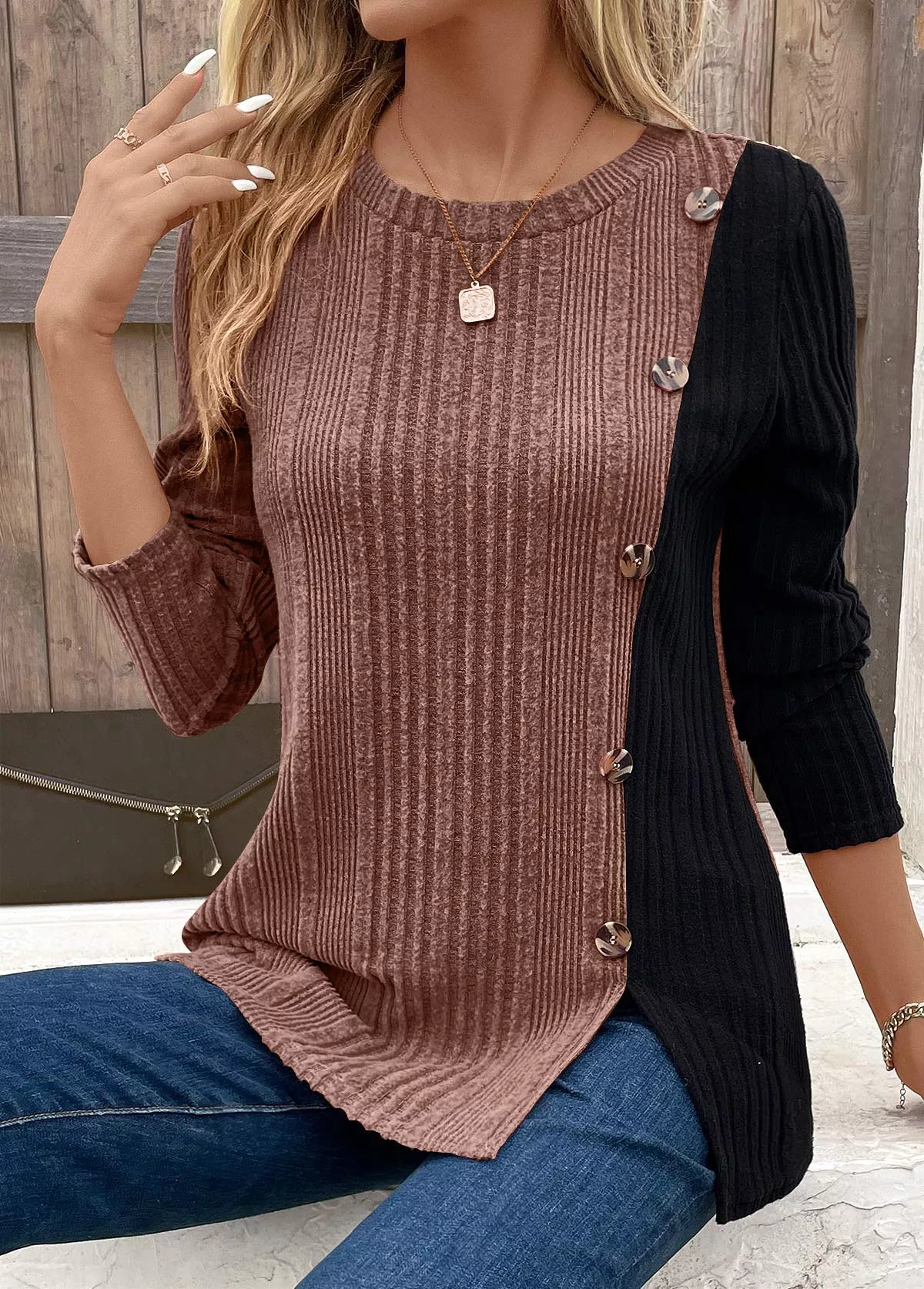Women’s taupe and black color block ribbed knit long sleeve top with decorative side buttons and slit detail, available in sizes Small–2XL.