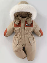 Children's taupe one-piece winter snowsuit featuring a fluffy white faux fur-trimmed hood, rust-colored accents, elasticized waist, and front pockets.