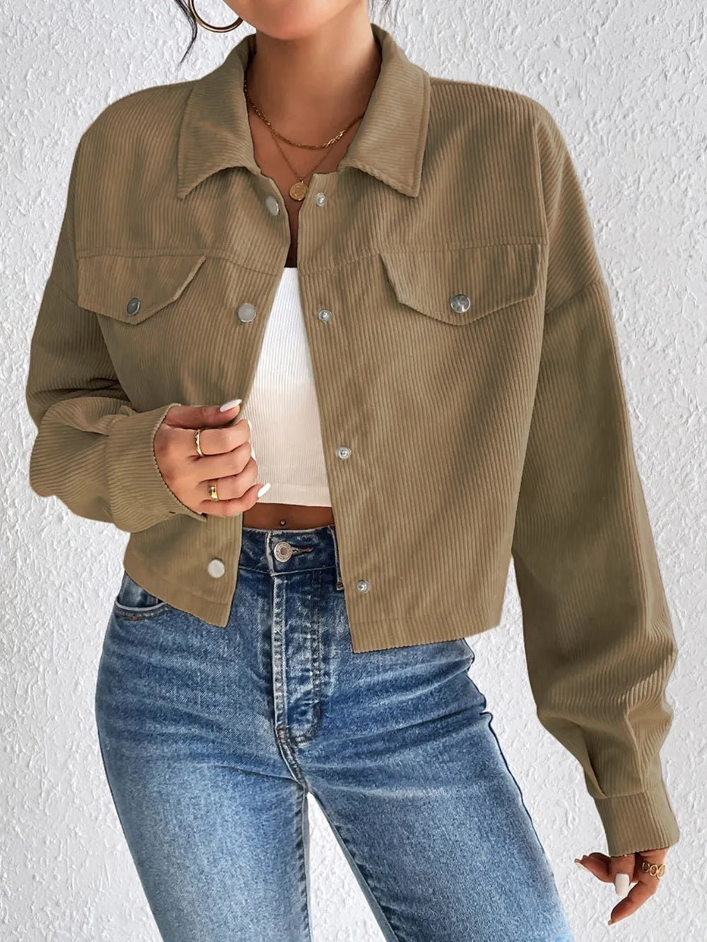 Woman wearing the Honey Snap Down Long Sleeve Jacket in taupe with blue jeans and a white top, lightweight women's fall jacket from Chic Mystik Boutique.