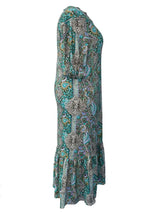 Woman wearing a teal bohemian paisley print midi dress with three-quarter sleeves and ruffled hem.