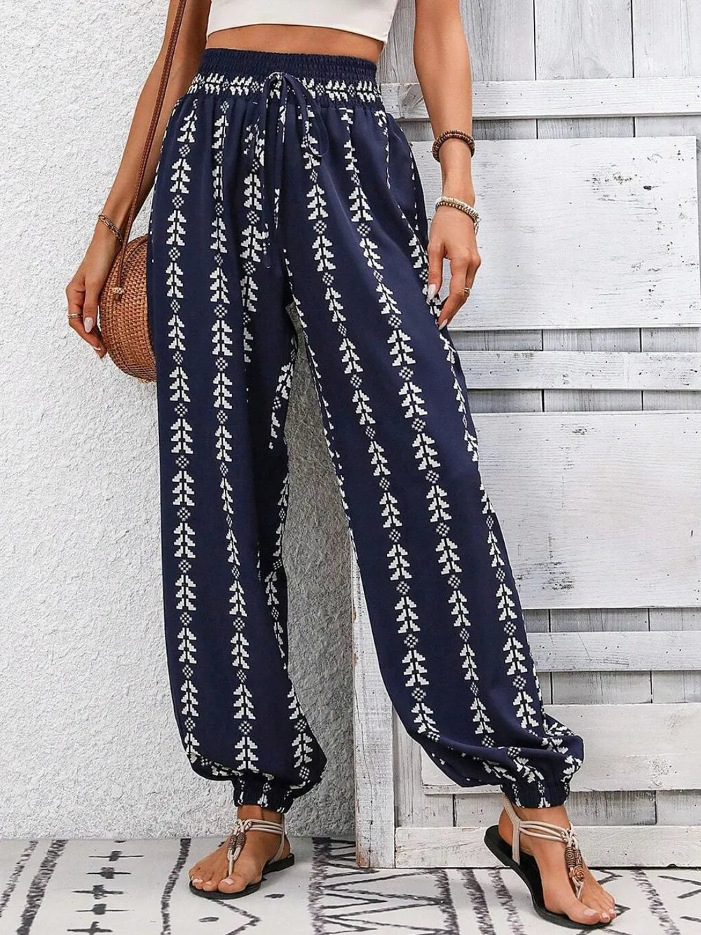 Your New Favorite Boho Pants Have Arrived - Tied Printed High Waist Pants – dark blue with geometric and floral print – front view