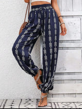 Comfort Meets Boho Chic - Tied Printed High Waist Pants – dark blue with geometric and floral print – front view