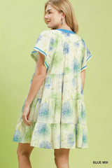 Woman wearing a floral dress with a green background