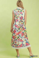 Woman wearing a colorful floral dress on a light green background
