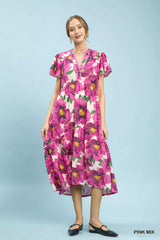 Woman wearing a pink floral dress on a light blue background