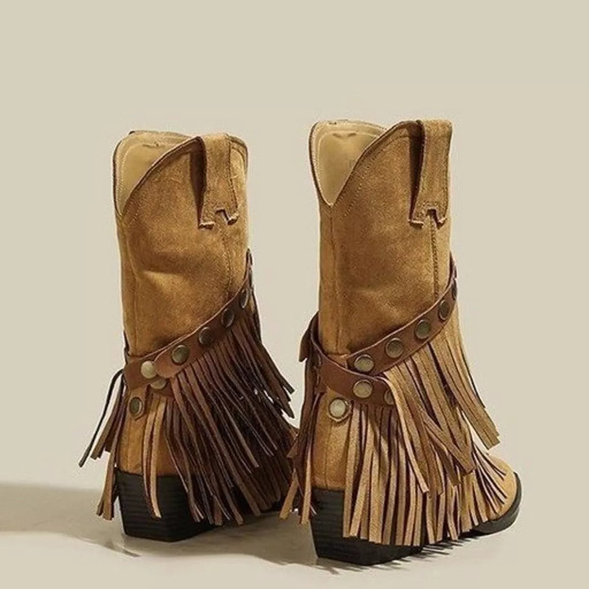 Khaki suede Western boots with pointed toes, layered fringe, studded straps and low heels.