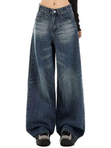 Woman wearing vintage wash high-rise wide leg blue jeans with a relaxed fit and classic five-pocket styling.
