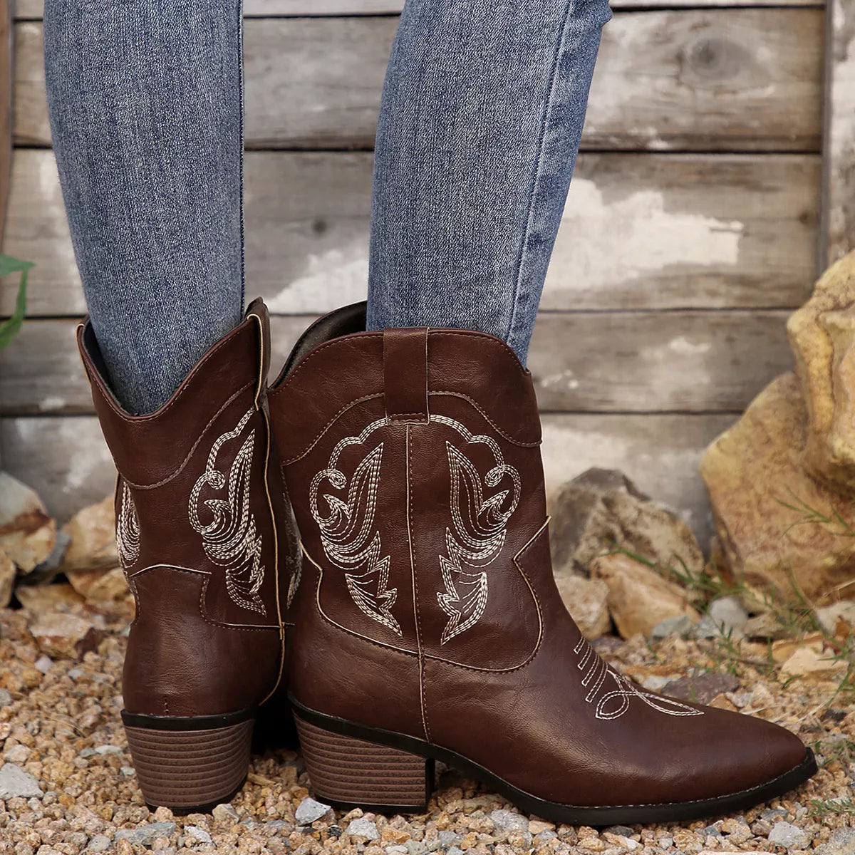 Women's brown Western cowboy boots with classic embroidered detailing and comfortable mid heel.