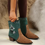 Women's green Western cowboy boots with classic embroidered detailing and comfortable mid heel.