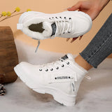 Women’s fleece-lined lace-up combat boots with chunky rubber sole and side detail, available in khaki, black and white.