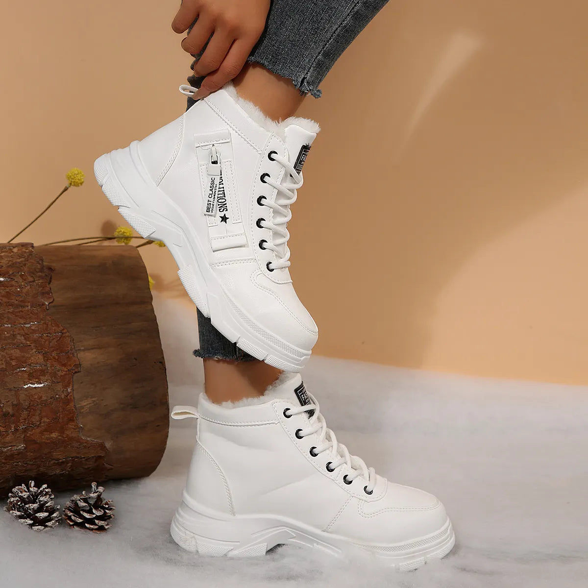 Women’s fleece-lined lace-up combat boots with chunky rubber sole and side detail, available in khaki, black and white.