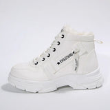 Women’s fleece-lined lace-up combat boots with chunky rubber sole and side detail, available in khaki, black and white.