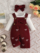 Baby girl three-piece outfit featuring a cream ribbed long-sleeve bodysuit with ruffled shoulders, wine red bow-embroidered overalls and matching wine-red bow headband.