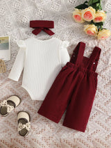 Baby girl three-piece outfit featuring a cream ribbed long-sleeve bodysuit with ruffled shoulders, wine red bow-embroidered overalls and matching wine-red bow headband.